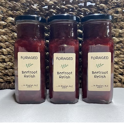 Three jars of Foraged in Raglans Beetroot relish in front of a basket