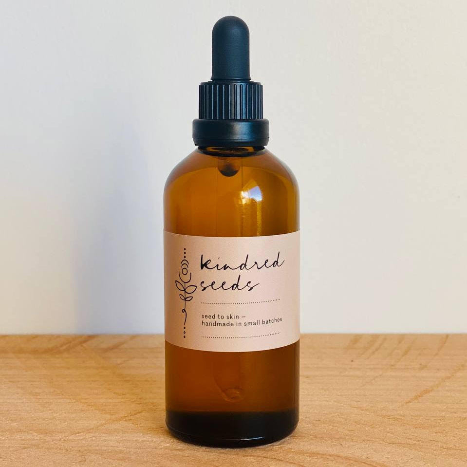 Natural body oil in a glass bottle